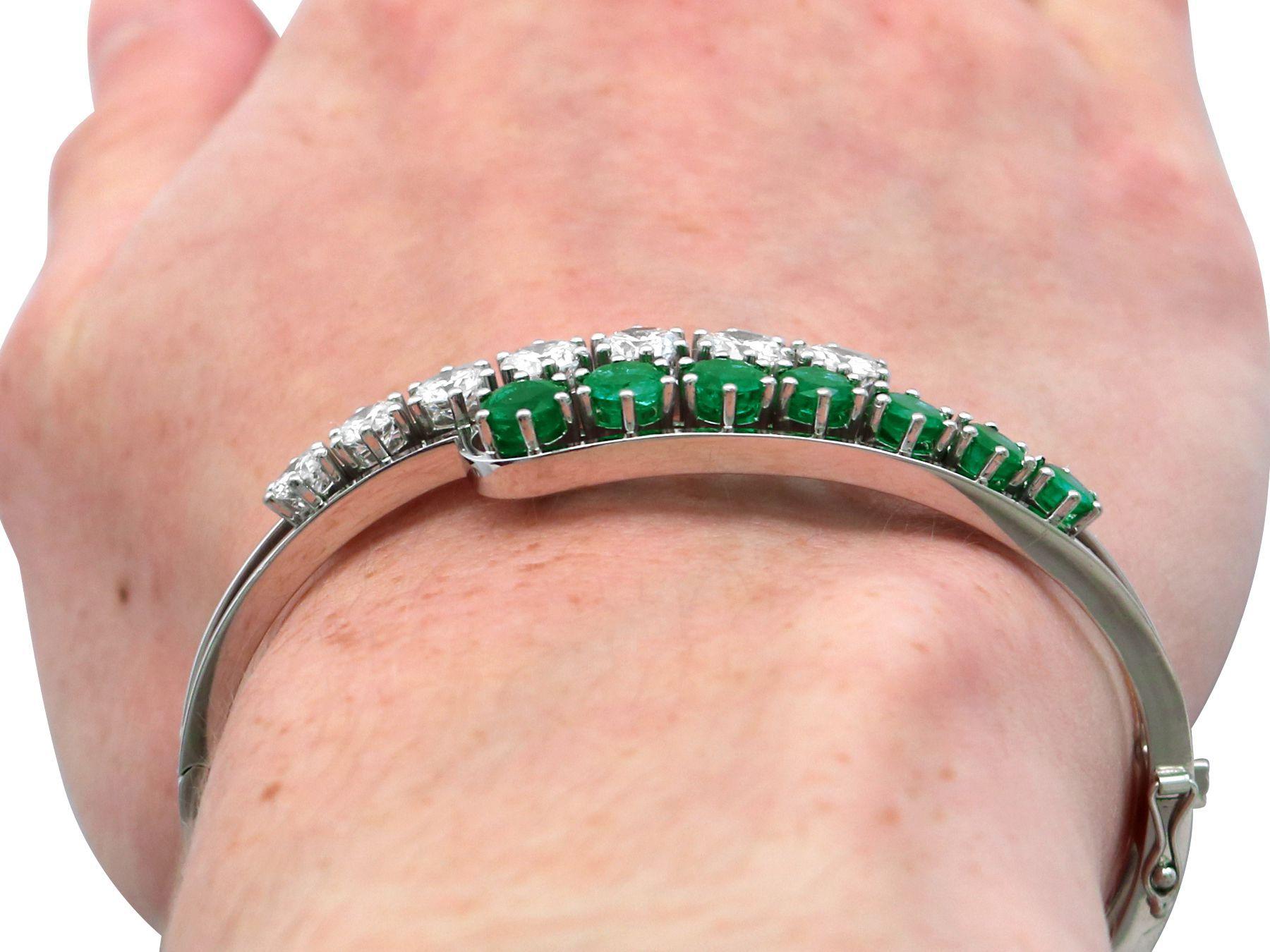 A stunning, fine and impressive vintage 3.20 carat emerald and 3.95 carat diamond 18 carat white gold bangle; part of our diverse vintage jewellery and estate jewelry collections

This stunning, fine and impressive vintage bangle has been crafted in