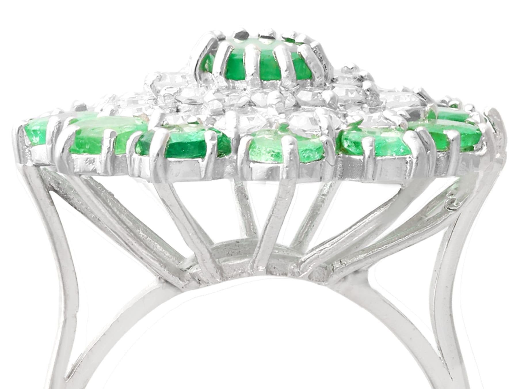 A fine and impressive vintage 3.29 carat natural emerald and 1.75 carat diamond 18 karat white gold cocktail ring; part of our diverse range of gemstone jewelry.

This impressive vintage oval cut cocktail ring has been crafted in 18k white