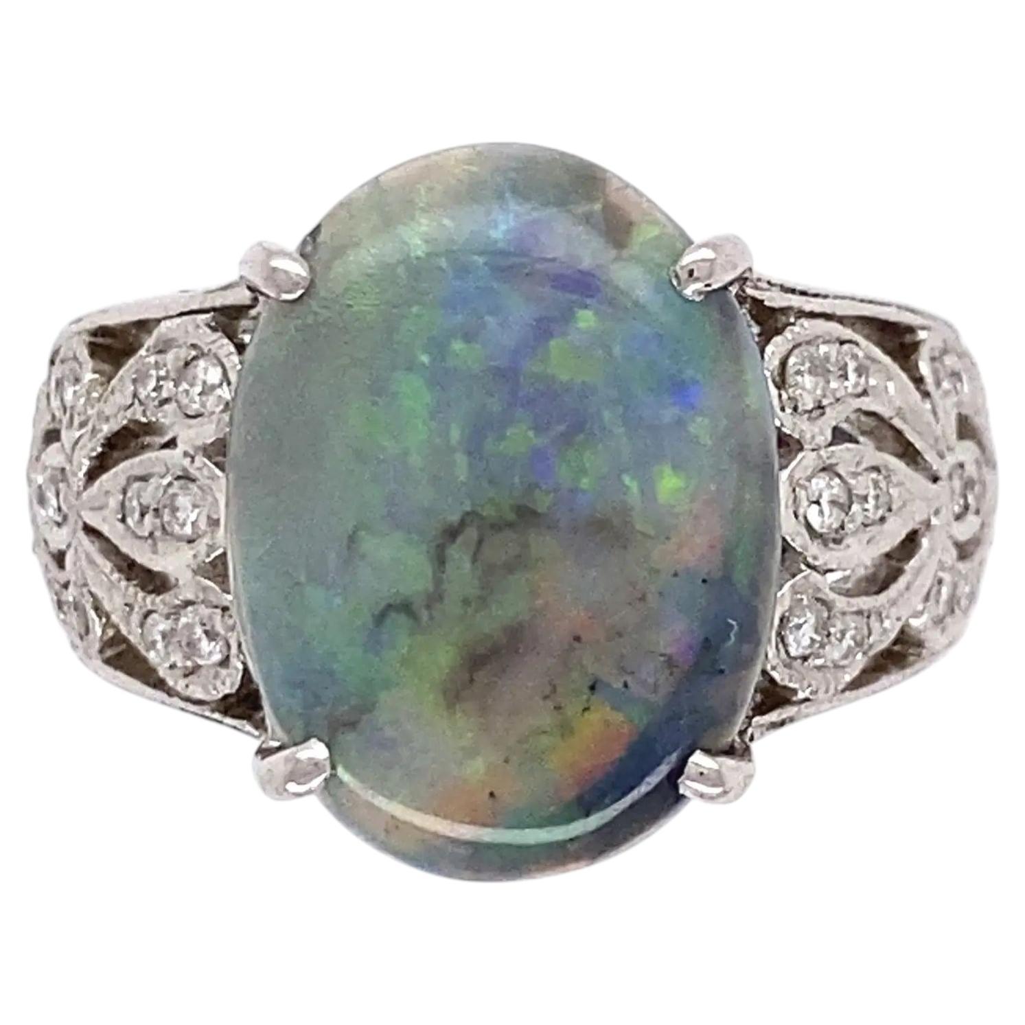 Vintage 3.32 Carat Oval Dark Gray Opal and Diamond Platinum Ring For Sale