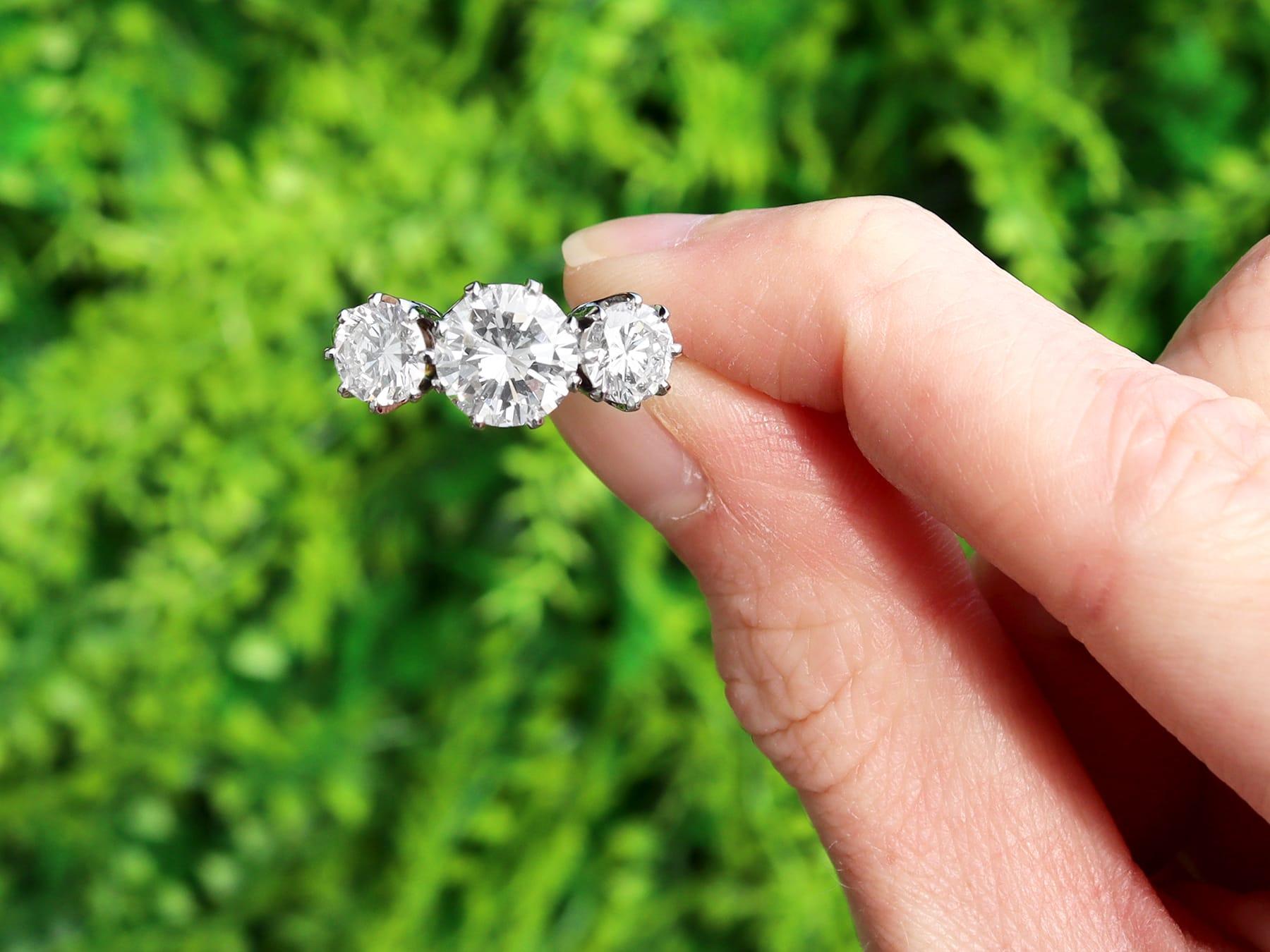 A magnificent, stunning, fine and impressive vintage 3.40 carat diamond and platinum trilogy ring; part of our diverse vintage engagement rings collection.

This magnificent, fine and impressive vintage three stone ring has been crafted in