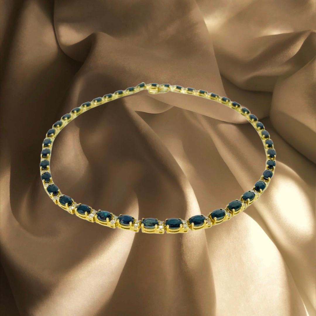 Vintage 34.85 Carat Blue Sapphires and Diamonds Tennis Chain Necklace. Très élégante et audacieuse, elle présente des diamants ronds d'un poids total d'environ 4,10 carats et des saphirs bleus d'un poids total d'environ 30,75 carats, soit un total