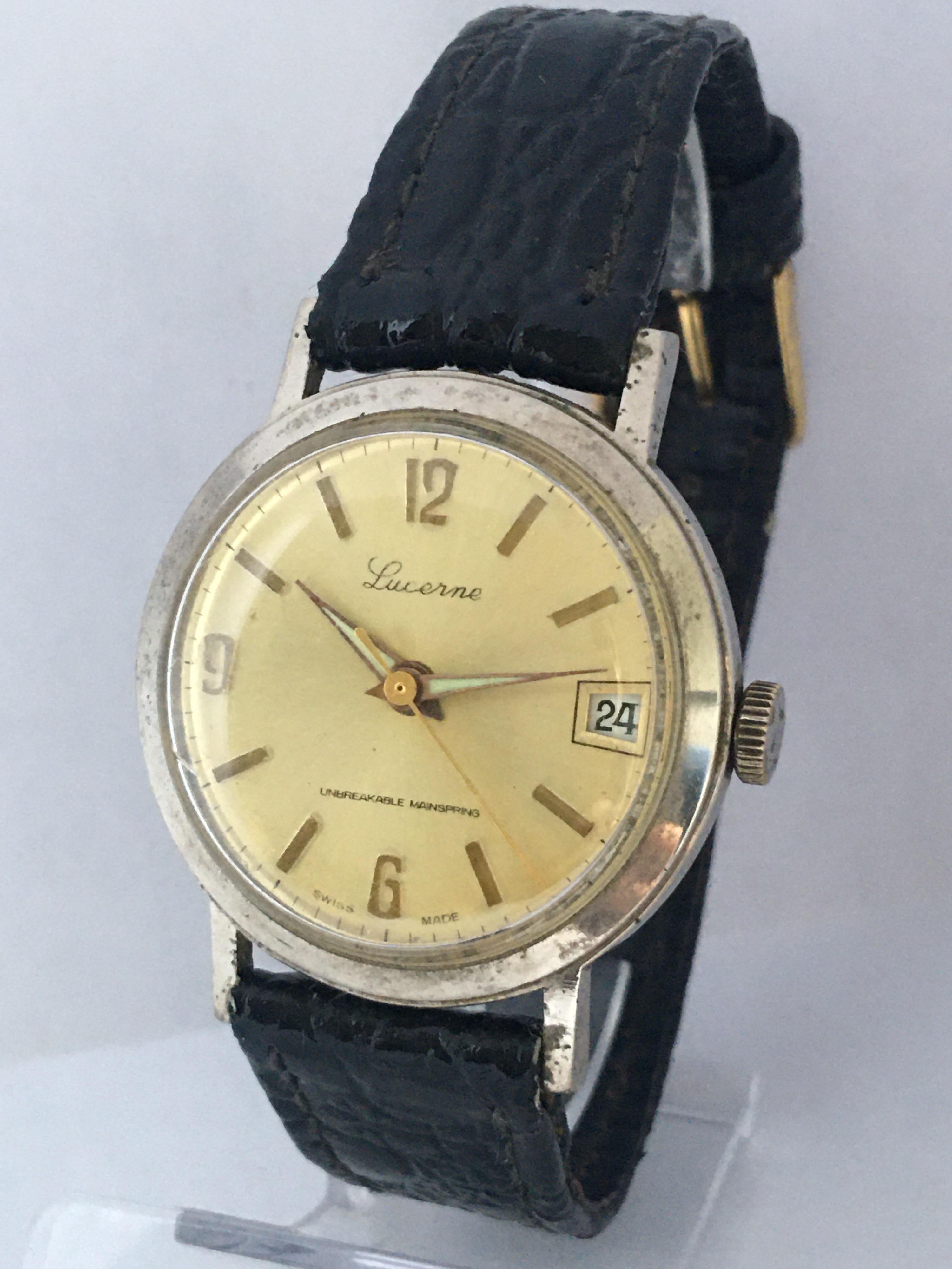 This beautiful pre-owned 34mm diameter vintage hand winding watch is in good working condition and it is ticking and running well. Visible signs of ageing and wear with light scratches on the glass and on the watch case as shown. The buckle strap is