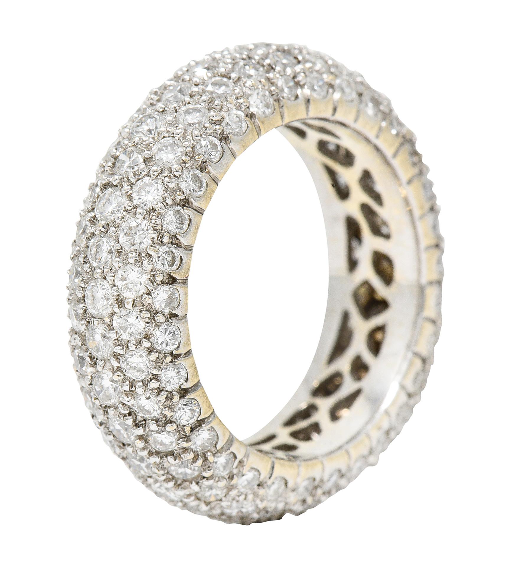 Band ring is designed with a rounded and dome-like curvature

Pavè set fully around with round brilliant cut diamonds

Weighing in total approximately 3.50 carats - G to I color with overall VS clarity

Completed by a pierced interior

Tested as 18