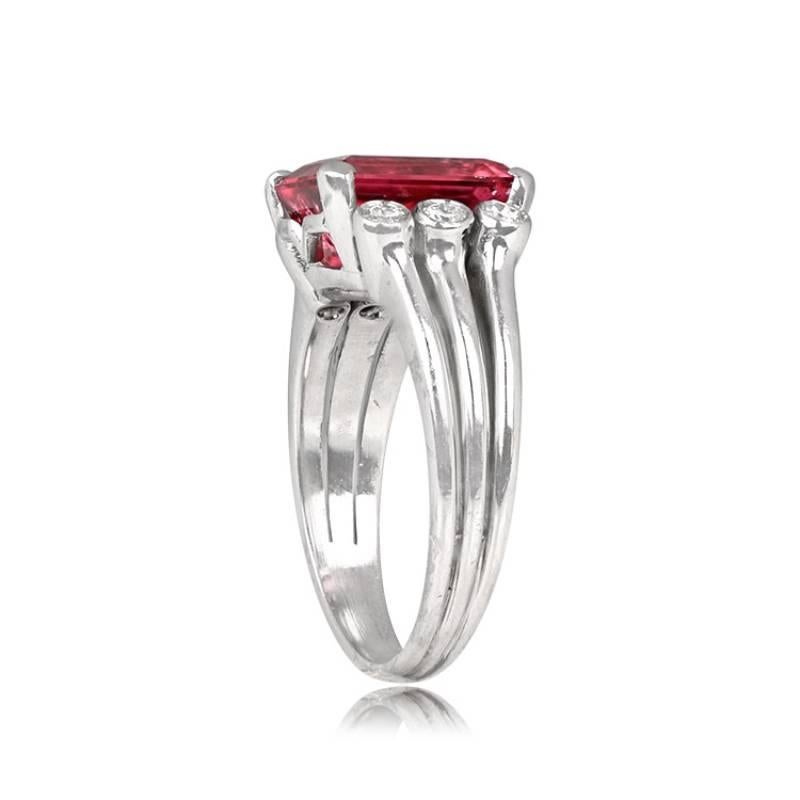 Platinum Retro Era Rubellite Ring: This vintage platinum ring showcases a stunning 3.52-carat emerald-cut rubellite, securely set in prongs. Enhancing the design, three bezel-set diamonds on each side accent the vibrant center stone, totaling 0.30