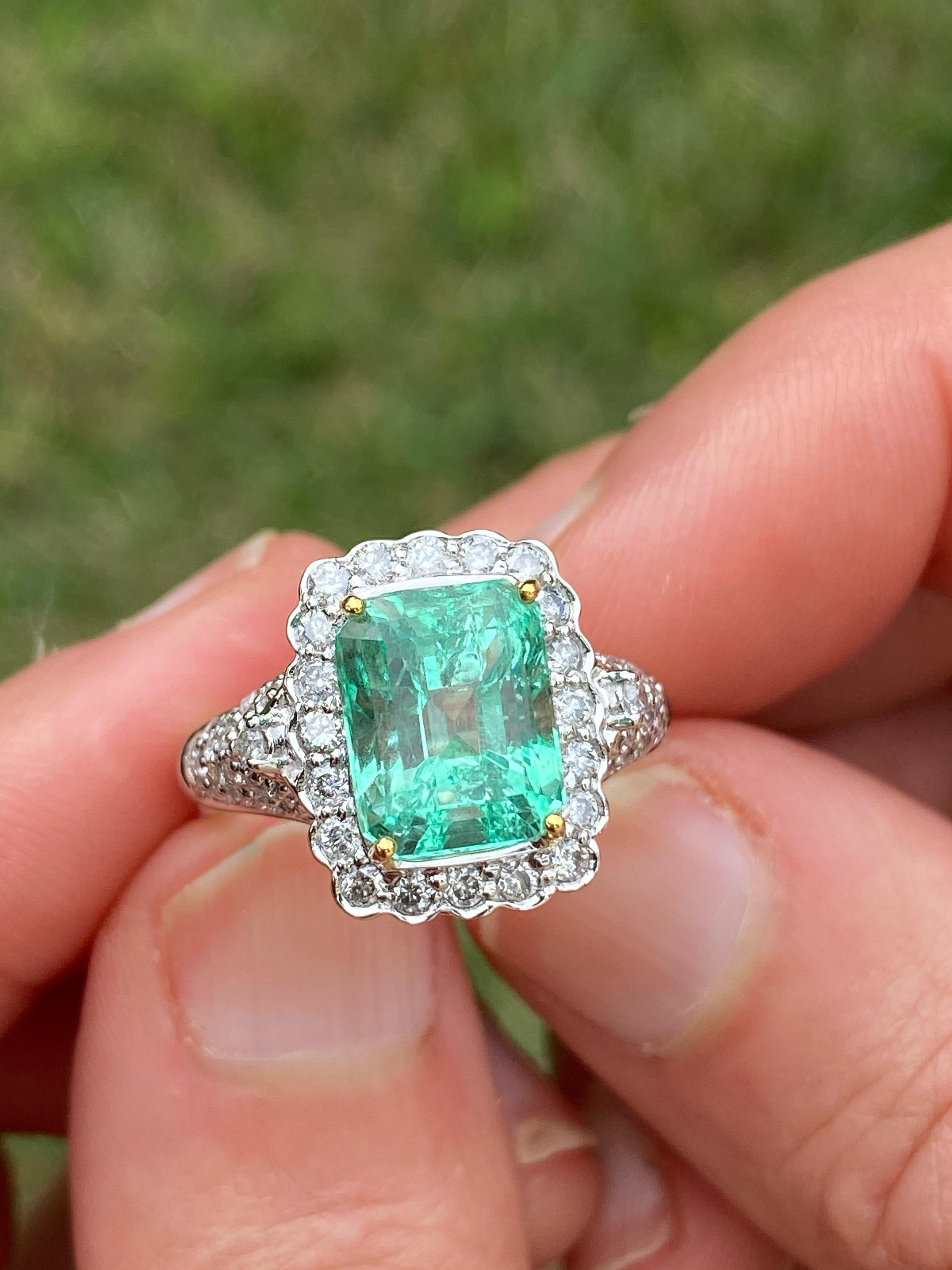 Centering a 3.58 Carat Emerald-Cut Colombian Emerald, accented by 0.71 Carats of Round-Brilliant Cut Diamonds, and set in 18K White Gold.

Details:
✔ Stone: Emerald
✔ Center-Stone Weight: 3.58 carats
✔ Stone Cut: Emerald
✔ Stone Color: Green
✔ Stone