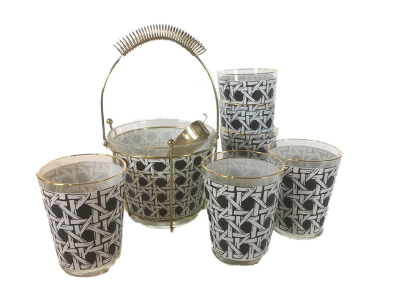 Vintage set of 36 double old fashioned glasses together with an Ice bowl with tong in caddy. All pieces decorated in black and white cane pattern with all glasses having a gold edged rim. In the Style of Georges Briard. All in excellent