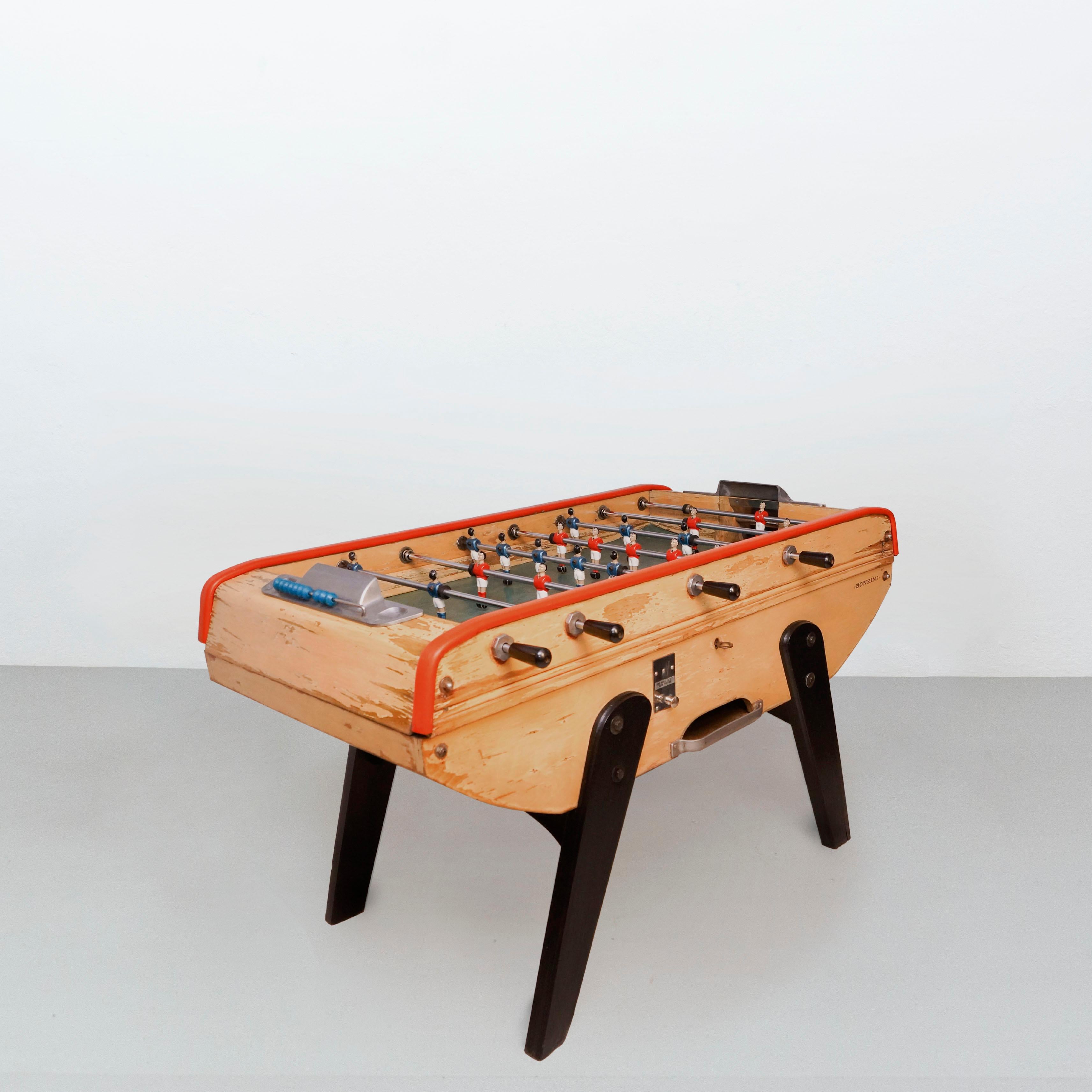 Table football by Bonzini from France, circa 1960.

In original condition, with minor wear consistent with age and use, preserving a beautiful patina.

Material:
Metal
Wood

Dimensions:
D 105 cm x W 150 cm x H 91 cm.