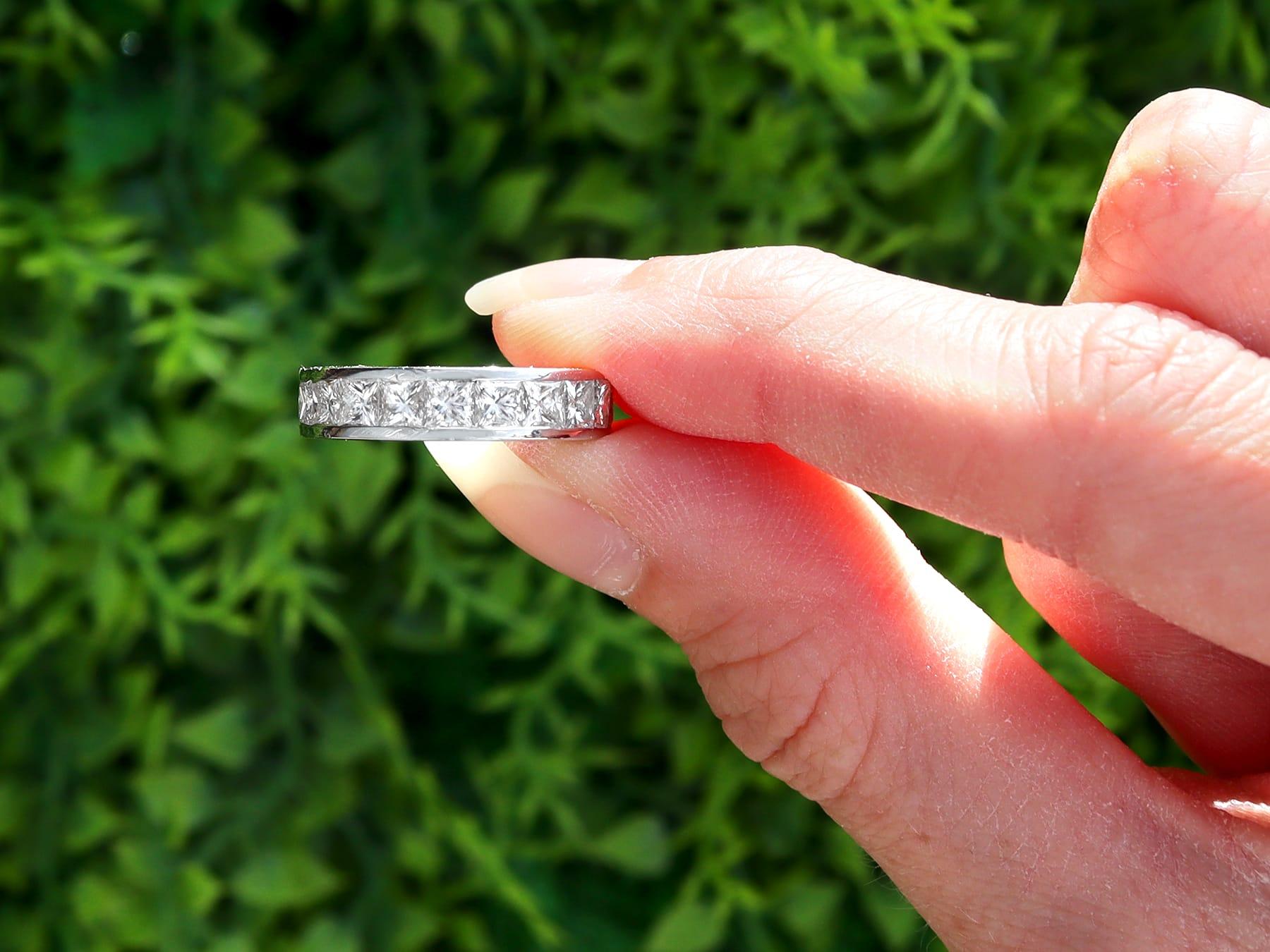 A stunning, fine and impressive vintage 3.62 carat princess cut diamond and 18 karat white gold eternity ring; part of our diverse collection of vintage diamond eternity rings.

This stunning, fine and impressive vintage eternity ring has been