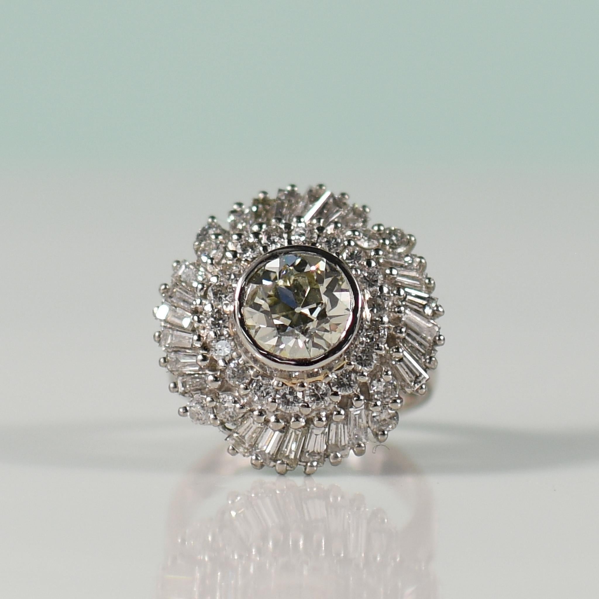 Step into a world of vintage glamour with this exquisite diamond ballerina ring, a true symbol of timeless elegance. At its heart lies a dazzling 1.65 carat old European cut diamond, exuding a captivating sparkle that harks back to a bygone era.