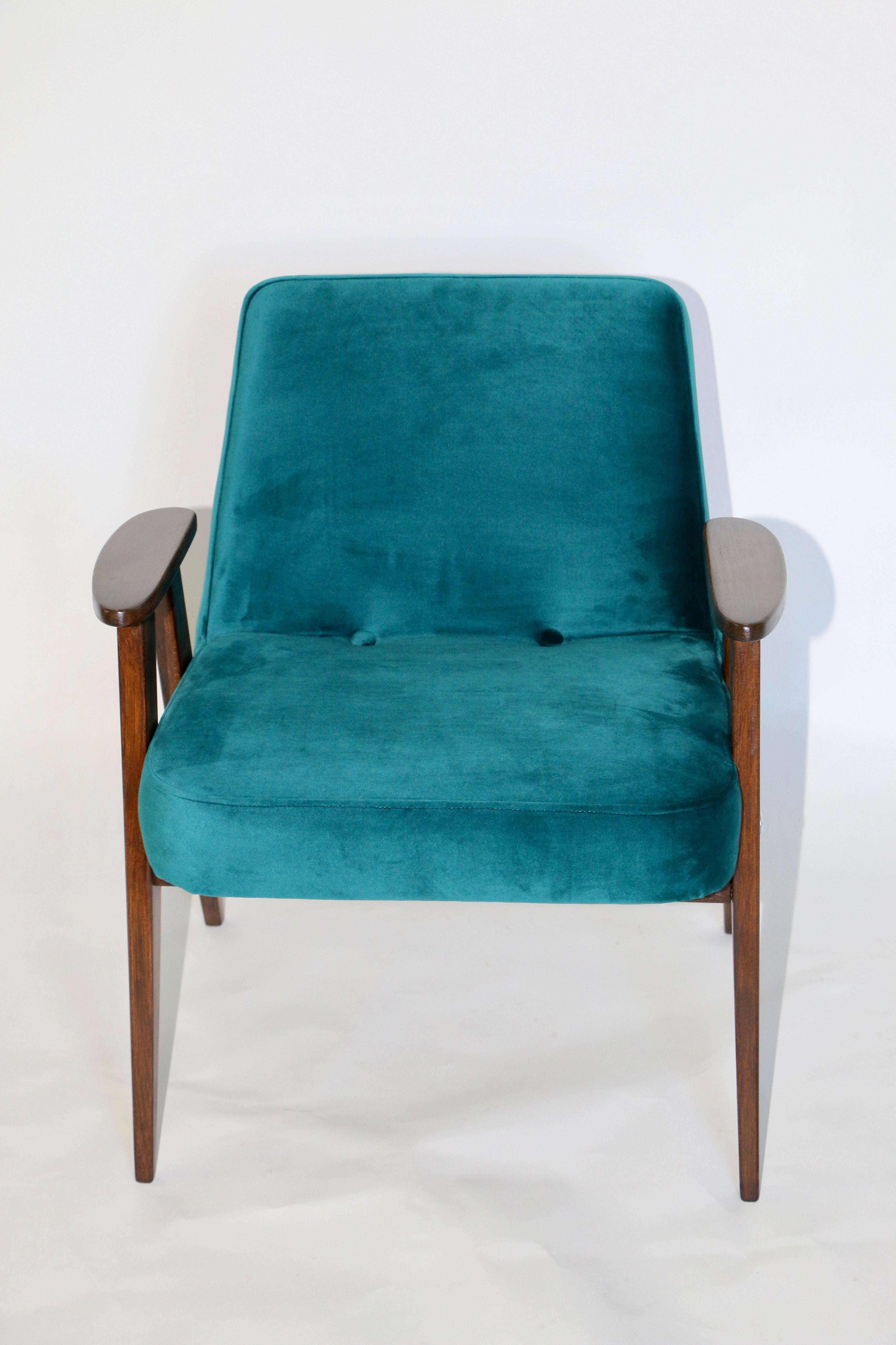 Polish 366 armchair design by Jozef Chierowski in green made velvet from 1970s, new upholstery covered with velvet fabric in fashionable dark green color, finished with wooden chair cushion. Wooden elements in dark oak color. Perfect condition. This