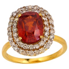 Anello cocktail d'epoca con granato Spessartine 3,70 e diamanti in oro giallo 18 carati