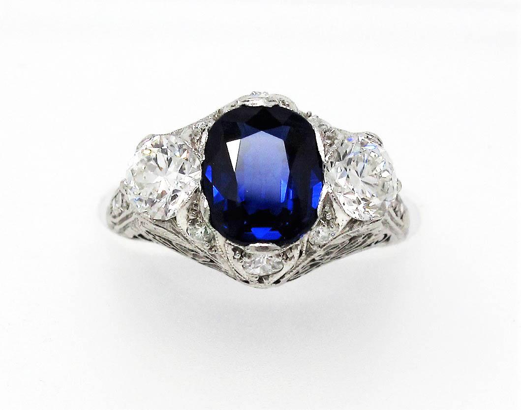 Absolutely breathtaking vintage Cambodian sapphire and diamond ring. The brilliant blue stone against the bright white diamonds really catches the viewers eye. Exquisite detail work combined with the incredible, rare untreated sapphire stone, makes