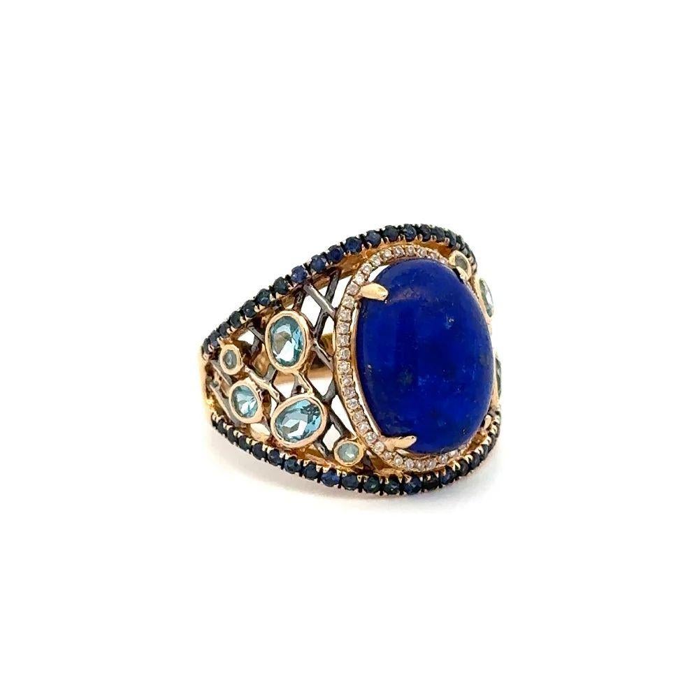 Simply Beautiful! Elegant and finely detailed Lapis Lazuli, Diamond, Sapphire and Topaz Vintage Dome Cluster Ring. Centering a Securely Hand set Cabochon Blue Lapis Lazuli, surrounded by Diamonds, approx. 0.15tcw, Sapphires and Topaz. Hand crafted