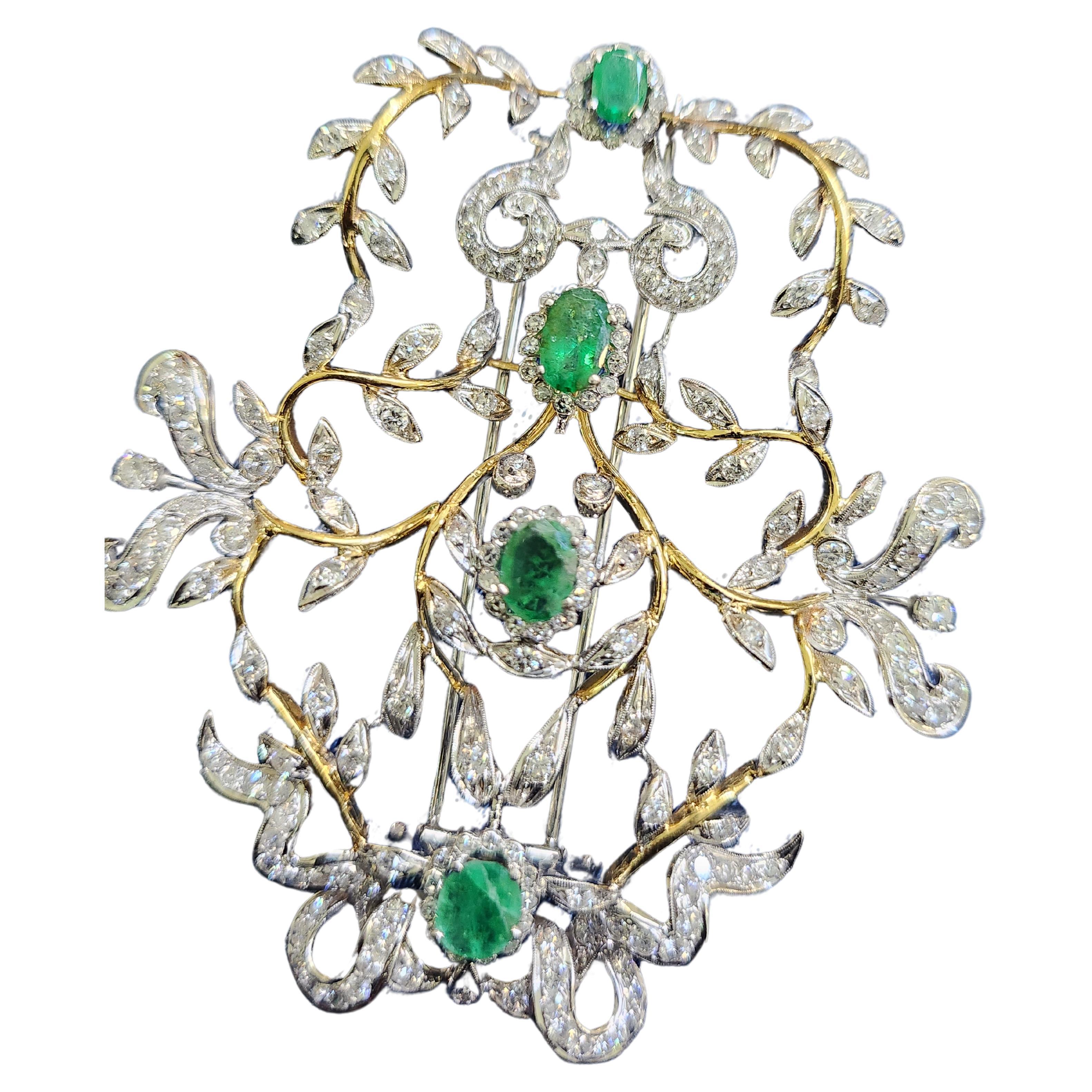 Vintage 18k yellow and white gold large brooch with an estimate brilliant diamond weight of 4 carats and more with natural green emeralds estimate weight 3 carats in oval cut with total gold weight of 25 grams hall marked on pin 