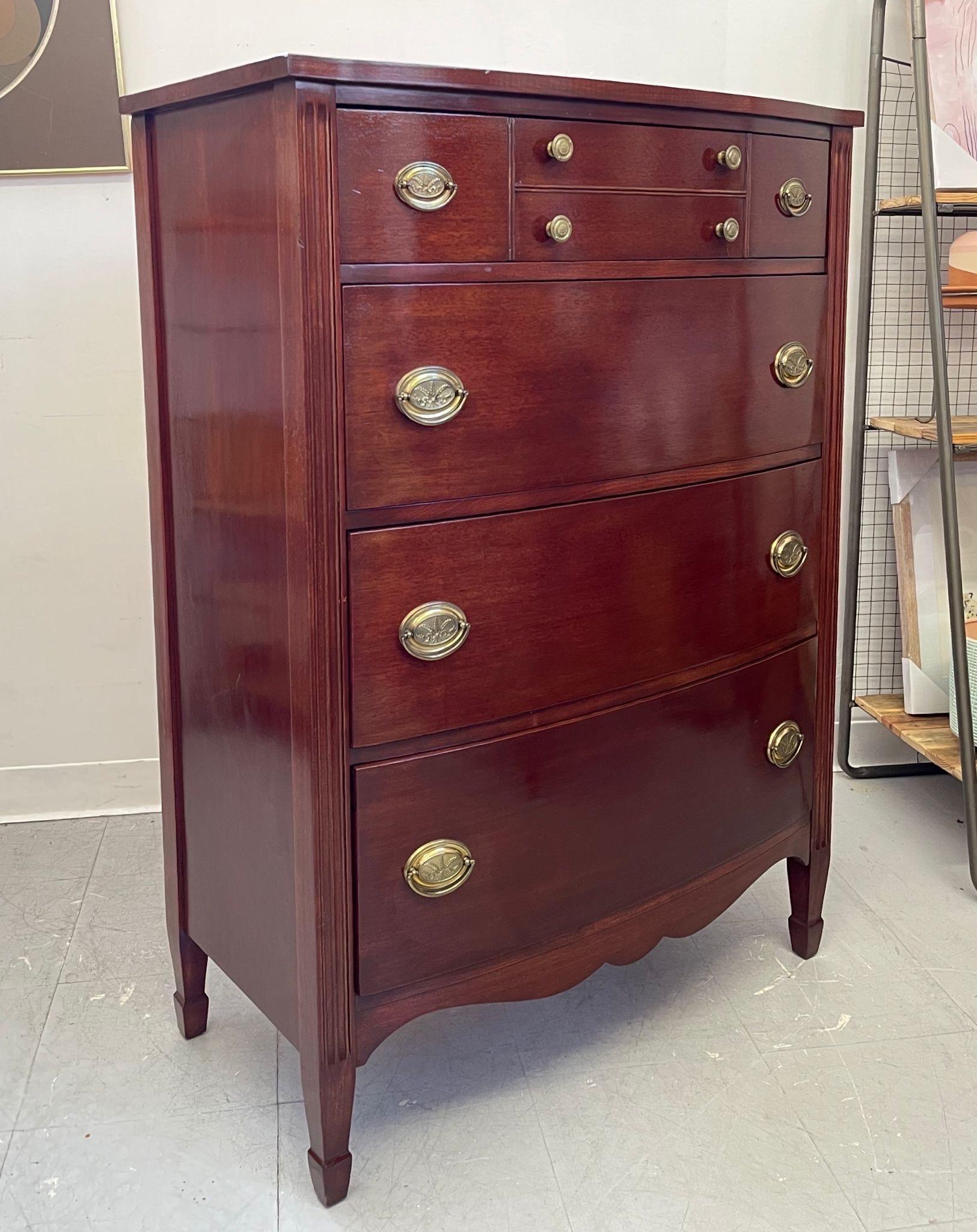 Makers mark on the back. Removable glass protective top layer. Curved Front, carved wood detailing. Wheat imagery on brass toned hardware. Deep set drawers. Vintage Condition Consistent with Age as Pictured.

Dimensions. 34 W ; 18 D ; 48 h