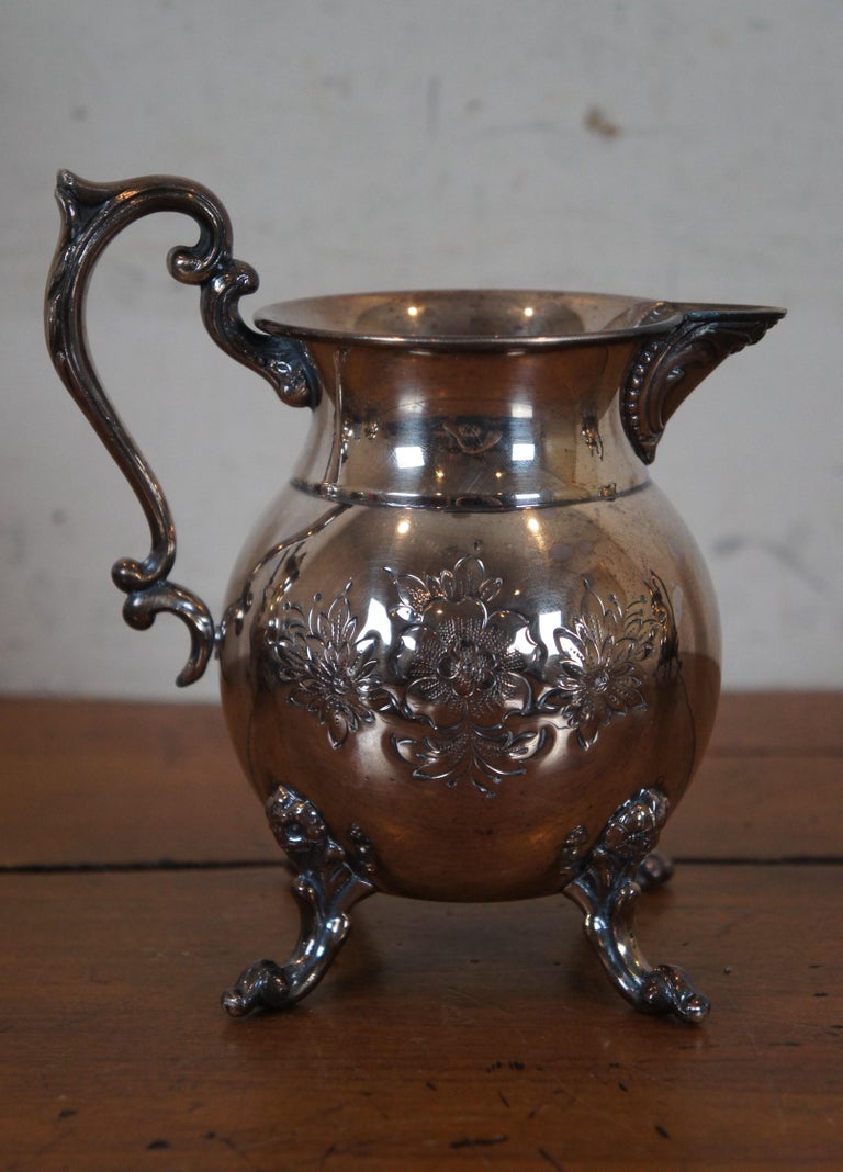 https://a.1stdibscdn.com/vintage-4-pc-sheridan-silver-plate-hand-chased-floral-tea-coffee-pitcher-set-for-sale-picture-9/f_53432/f_342752721684060485482/DSC00355_master.JPG?width=768