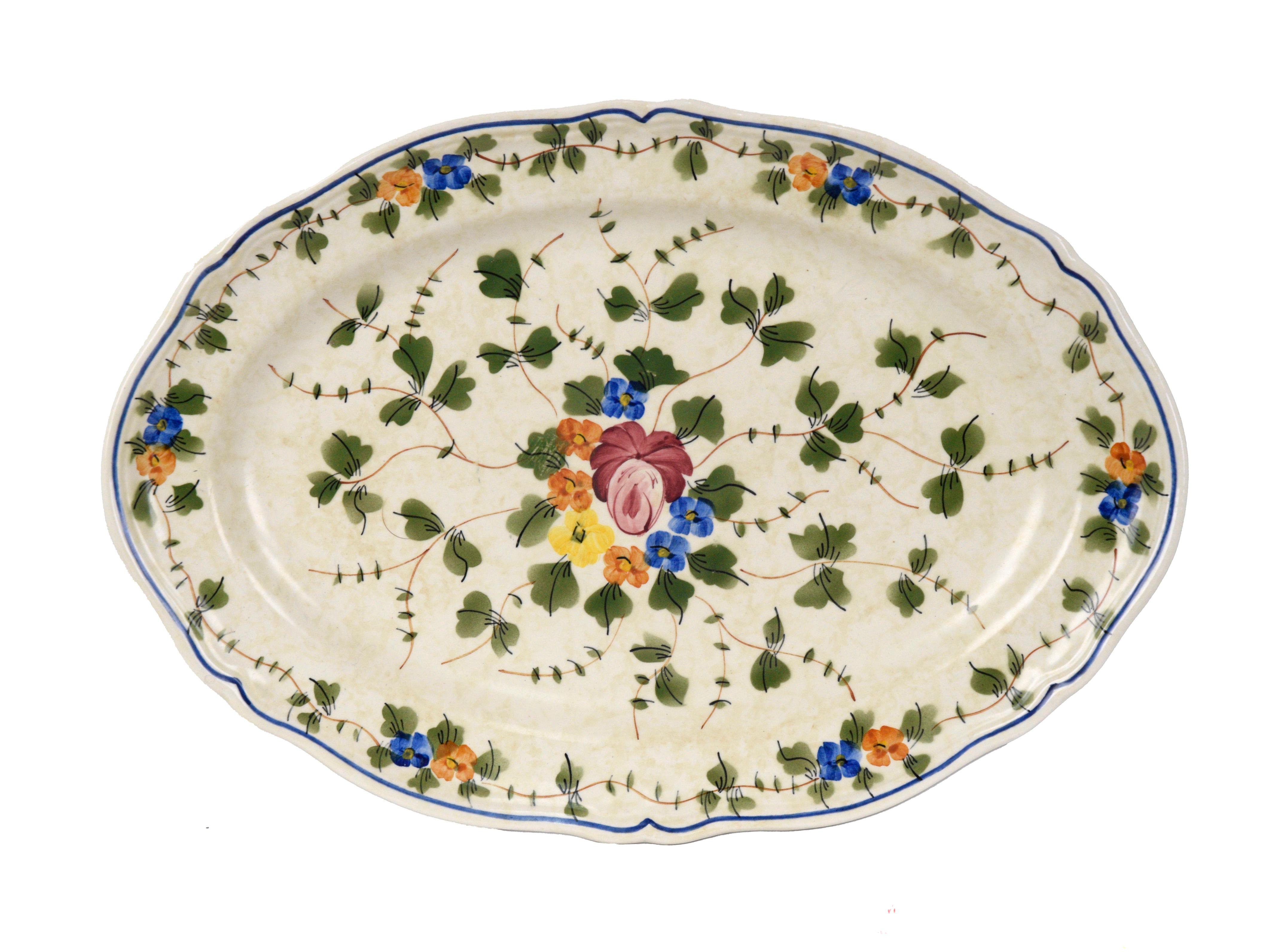 Vintage 4-Piece Longchamp Place Settings with Serving Tray, Set of 6, France

This beautifully hand-painted dish set is in good condition. The floral pattern features brightly colored violas encircled by green vines.

Set includes 6 of each, plus