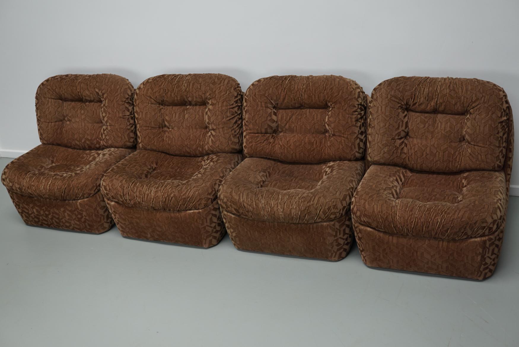 This vintage modular sofa was made around the 1970s in Italy. It features 4 elements covered in brown / beige corduroy fabric. It is very comfortable and only shows minimal signs of wear as shown in the photo's.