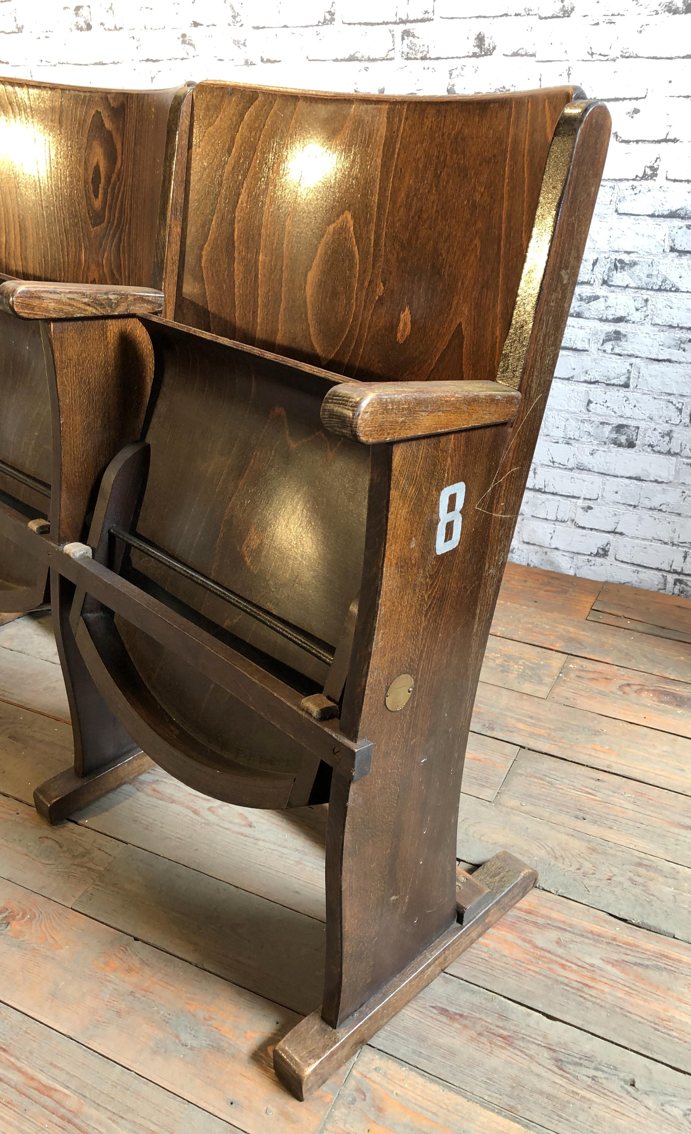 This four-seat cinema bench was produced by Ton (former Thonet) in Czechoslovakia during the 1950s. The chairs are stabile and can be placed anywhere. It is completely made of wood (partly solid wood, partly plywood). The seats fold upwards. The