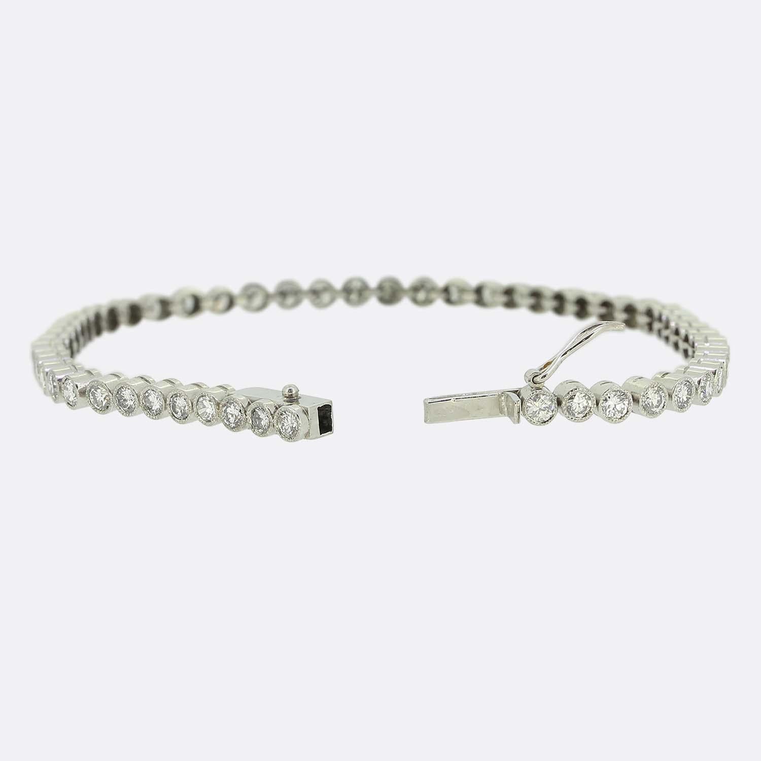 Here we have a charming diamond line bracelet. This vintage piece has been crafted from platinum and features 49 round brilliant cut diamonds in a single line formation. Each bright white stone is well matched in terms of colour, size and presence
