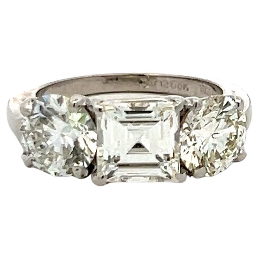 Vintage 4.02 Carat Asscher and Round GIA Diamonds Platinum Three-Stone Ring