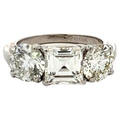 Vintage 4.02 Carat Asscher and Round GIA Diamonds Platinum Three-Stone Ring