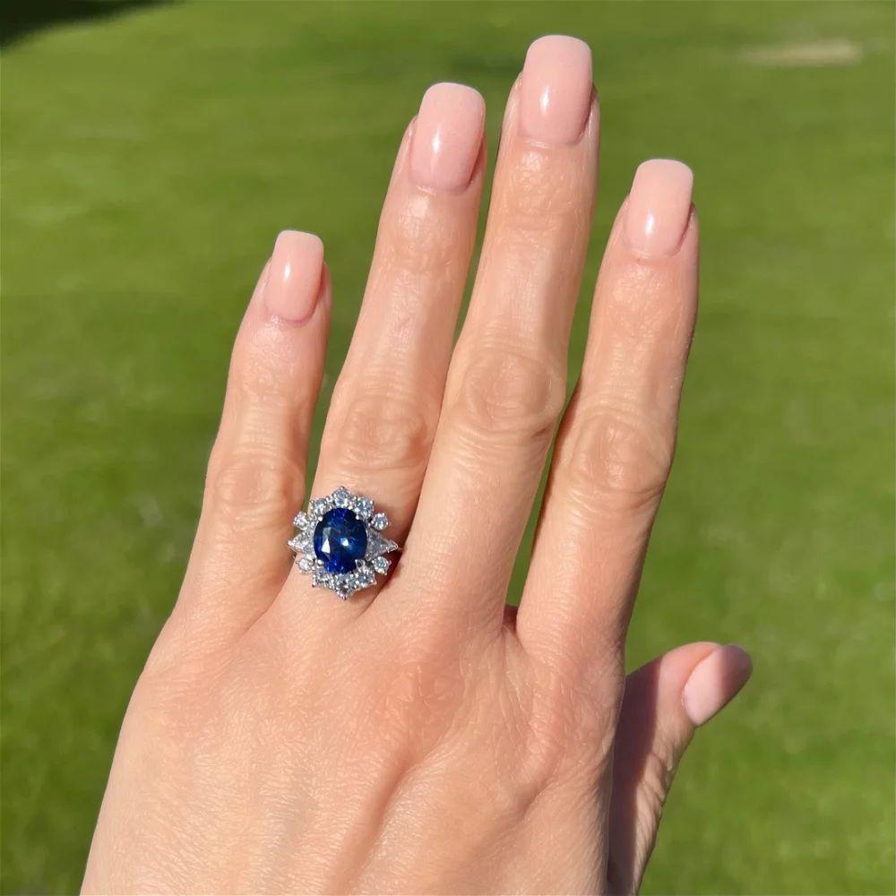 Modern Vintage 4.05 Carat Oval Vivid Blue Sapphire GRS and Diamond Gold Cocktail Ring For Sale