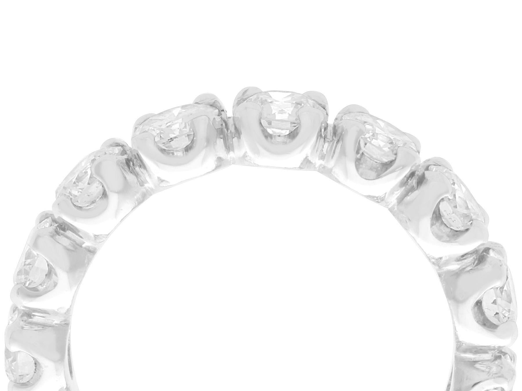A stunning, fine and impressive vintage French 4.10 carat diamond and 18 karat white gold full eternity ring; part of our diverse diamond jewelry and estate jewelry collections. 

This stunning, fine and impressive full eternity ring has been