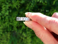 Vintage 4.15 Carat Emerald Cut Diamond and Platinum Eternity Ring
