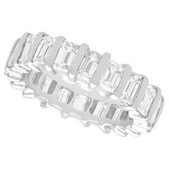 Vintage 4.15 Carat Emerald Cut Diamond and Platinum Eternity Ring