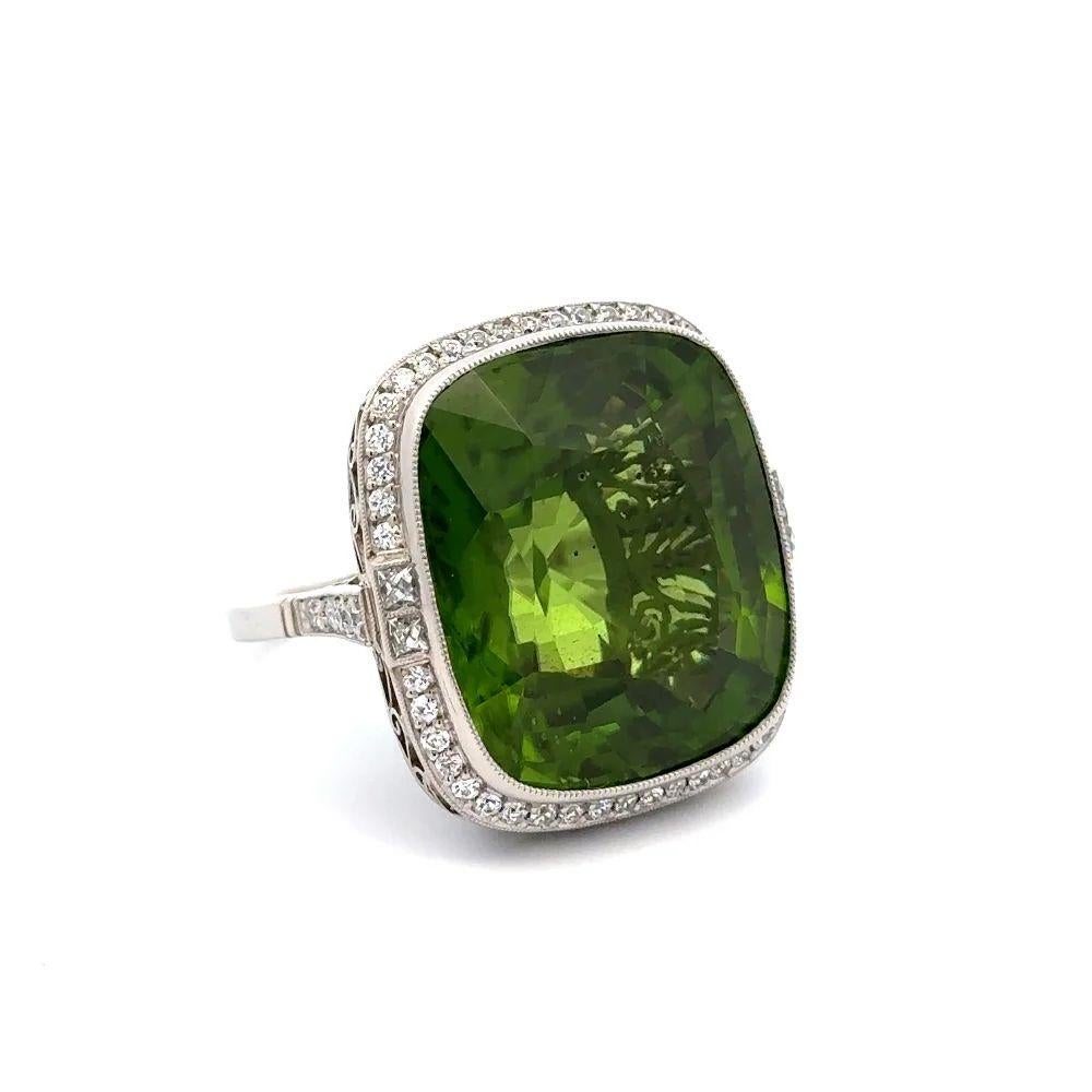 Simply Beautiful! Finely detailed Vintage Red Carpet Green Peridot GIA and Diamond Platinum Solitaire Statement Cocktail Ring. Centering a securely nestled Hand set 41.84 Carat GIA Intense Green Peridot, surrounded by Old European Cut Diamonds,