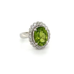 Vintage 4.19 Carat Oval Peridot and Diamond Platinum Halo Ring