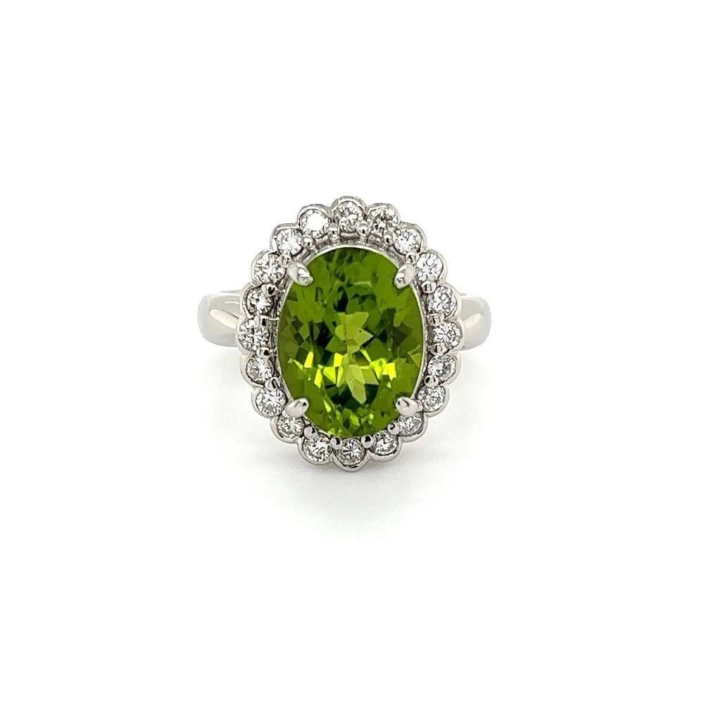 Oval Cut Vintage 4.19 Carat Oval Peridot and Diamond Platinum Halo Ring For Sale
