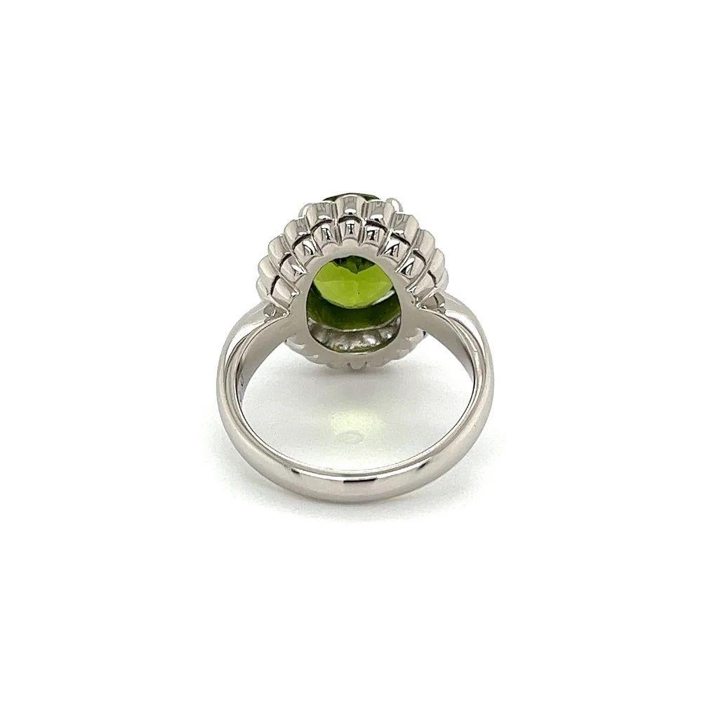 Vintage 4.19 Carat Oval Peridot and Diamond Platinum Halo Ring In Excellent Condition For Sale In Montreal, QC