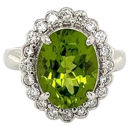 Vintage 4.19 Carat Oval Peridot and Diamond Platinum Halo Ring For Sale