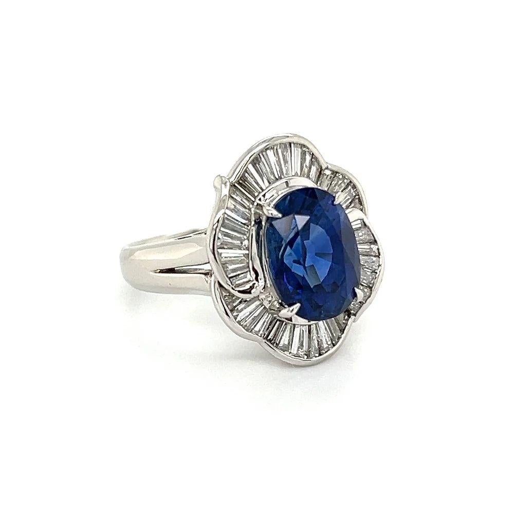 Simply Beautiful! Vintage Finely detailed Oval Ceylon Sapphire GIA and Baguette Diamond Platinum Cocktail Ring. Centering a Hand set securely nestled Oval Ceylon Sapphire, weighing approx. 4.20 Carat. GIA certificate number 2225551234. Surrounded by