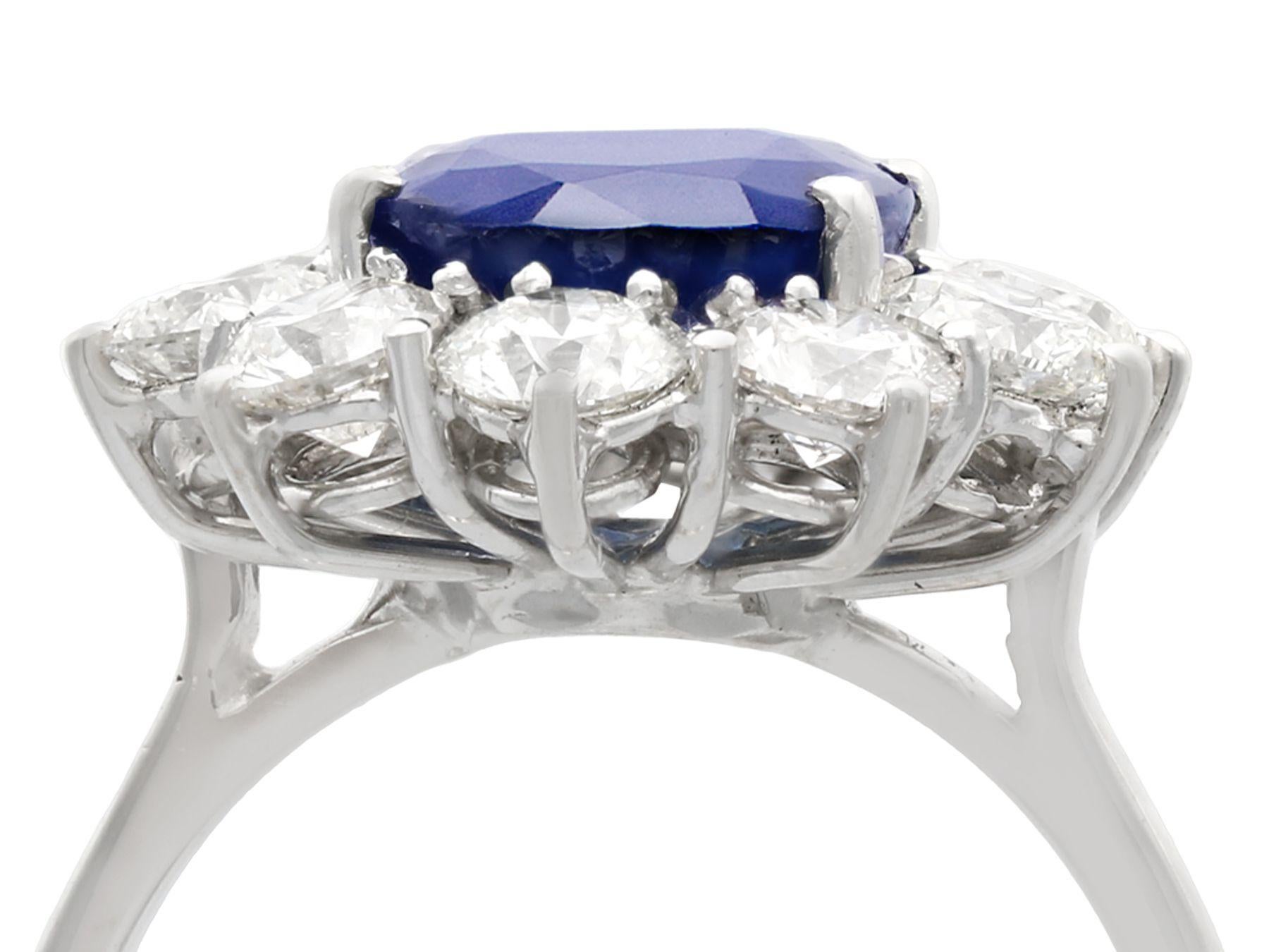 A stunning vintage 4.29 carat sapphire and 1.80 carat diamond, 18 karat white gold cluster ring; part of our diverse vintage jewelry and estate jewelry collections.

This stunning, fine and impressive vintage sapphire and diamond ring has been