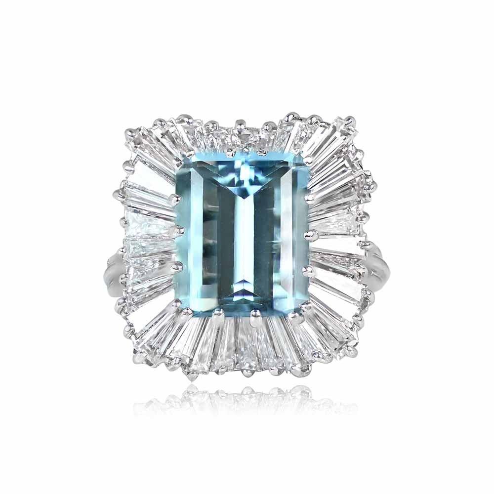 A vintage geometric ring showcasing a 4.34-carat emerald-cut aquamarine accented by a ballerina-style halo of regular and tapered baguette-cut diamonds. Handcrafted in platinum circa 1970.

Ring Size: 6 US, Resizable 
Metal: Platinum
Stone: Diamond,