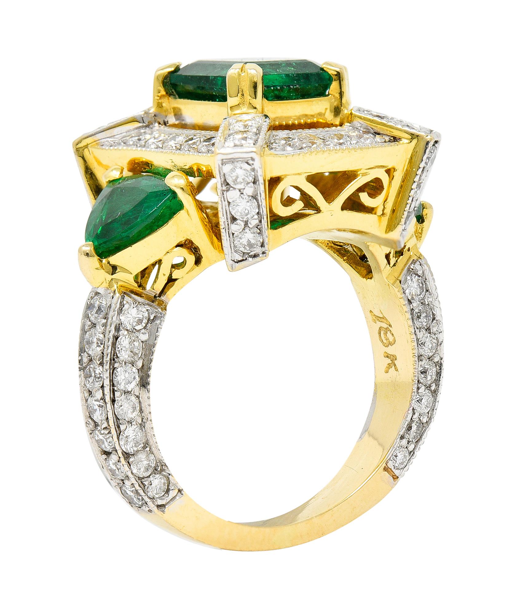 Substantial cocktail ring features an emerald cut emerald weighing approximately 2.00 carats

Flanked by triangular cut emeralds weighing collectively approximately 0.85 carats

Emeralds are all very well matched with saturated green in color and