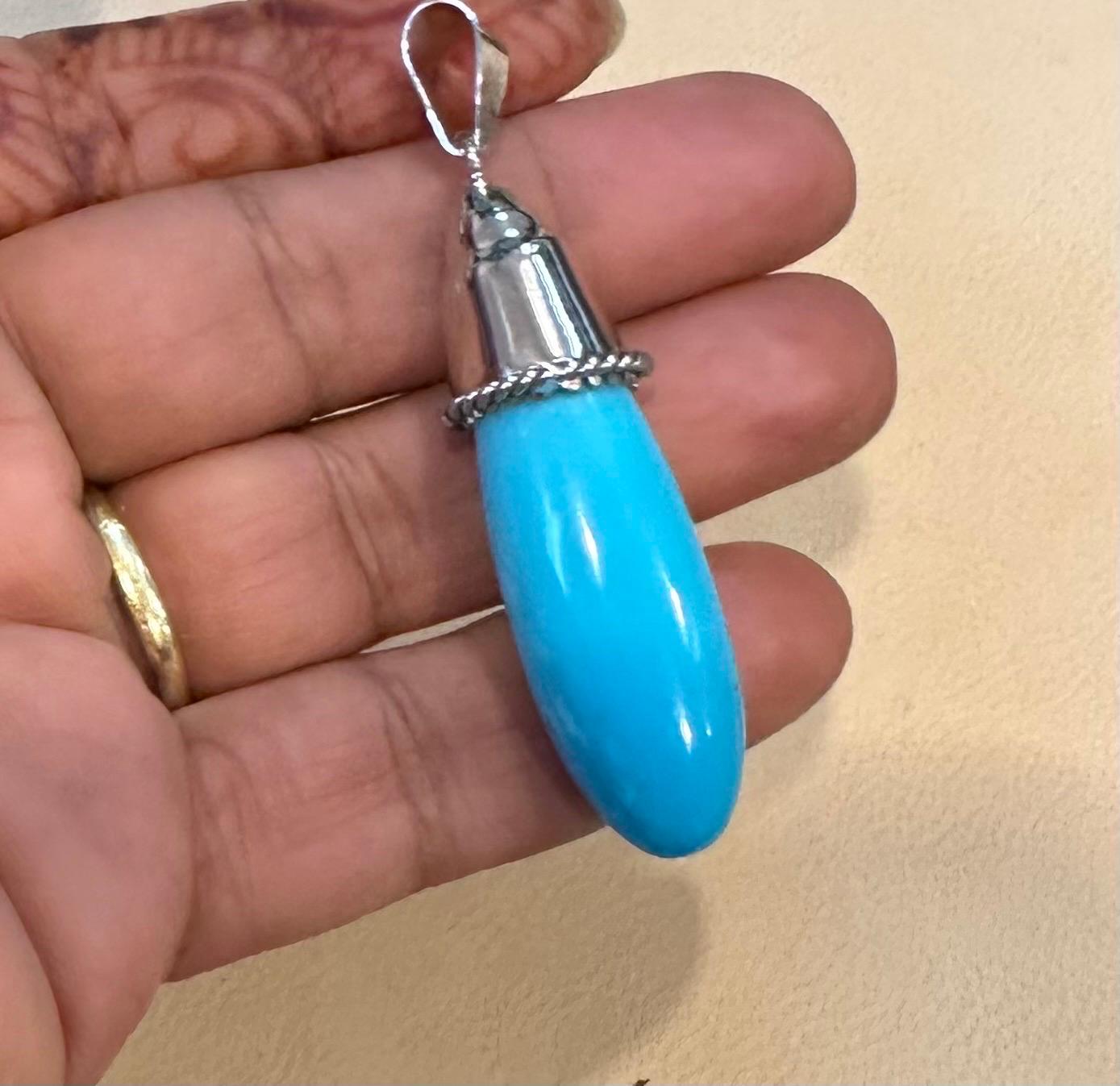 
Vintage approximately 45 to 50  Ct Natural Sleeping Beauty Turquoise Pendant, Big Bail

14 karat gold 12 Grams with stone.
 Natural Sleeping beauty Turquoise 30 ct, big drop with white gold cap
color is very beautiful and stone is amazing color ,