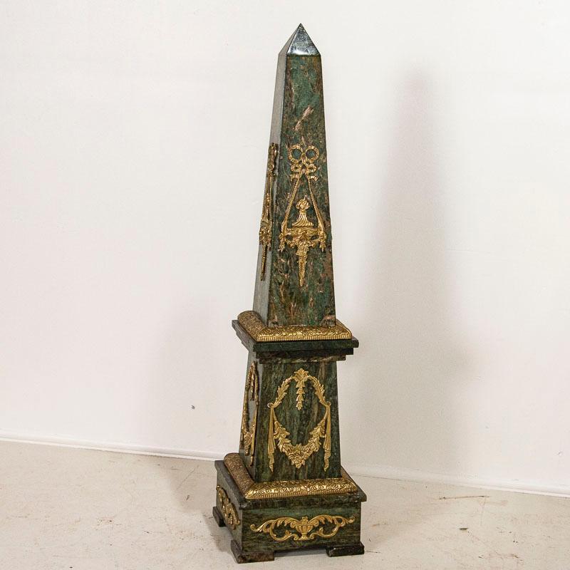 Elegance exudes from this standing marble sculpture obelisk from France. At over 4.5' tall, the attractive matrix of the green marble is complimented by traditional French brass accents. Minor wear to edges, scrapes/marks are commensurate with age