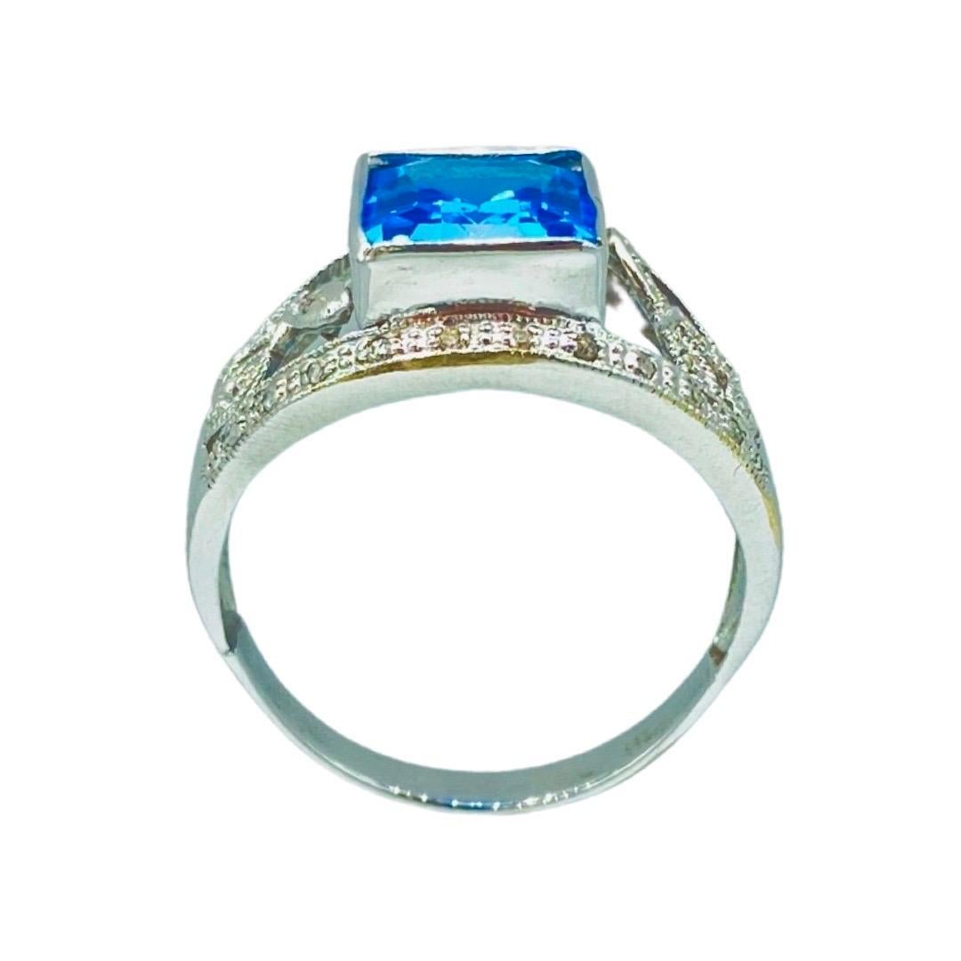 Emerald Cut Vintage 4.58 Carat Blue Topaz and Diamonds Floral Cocktail Ring 14k White Gold For Sale