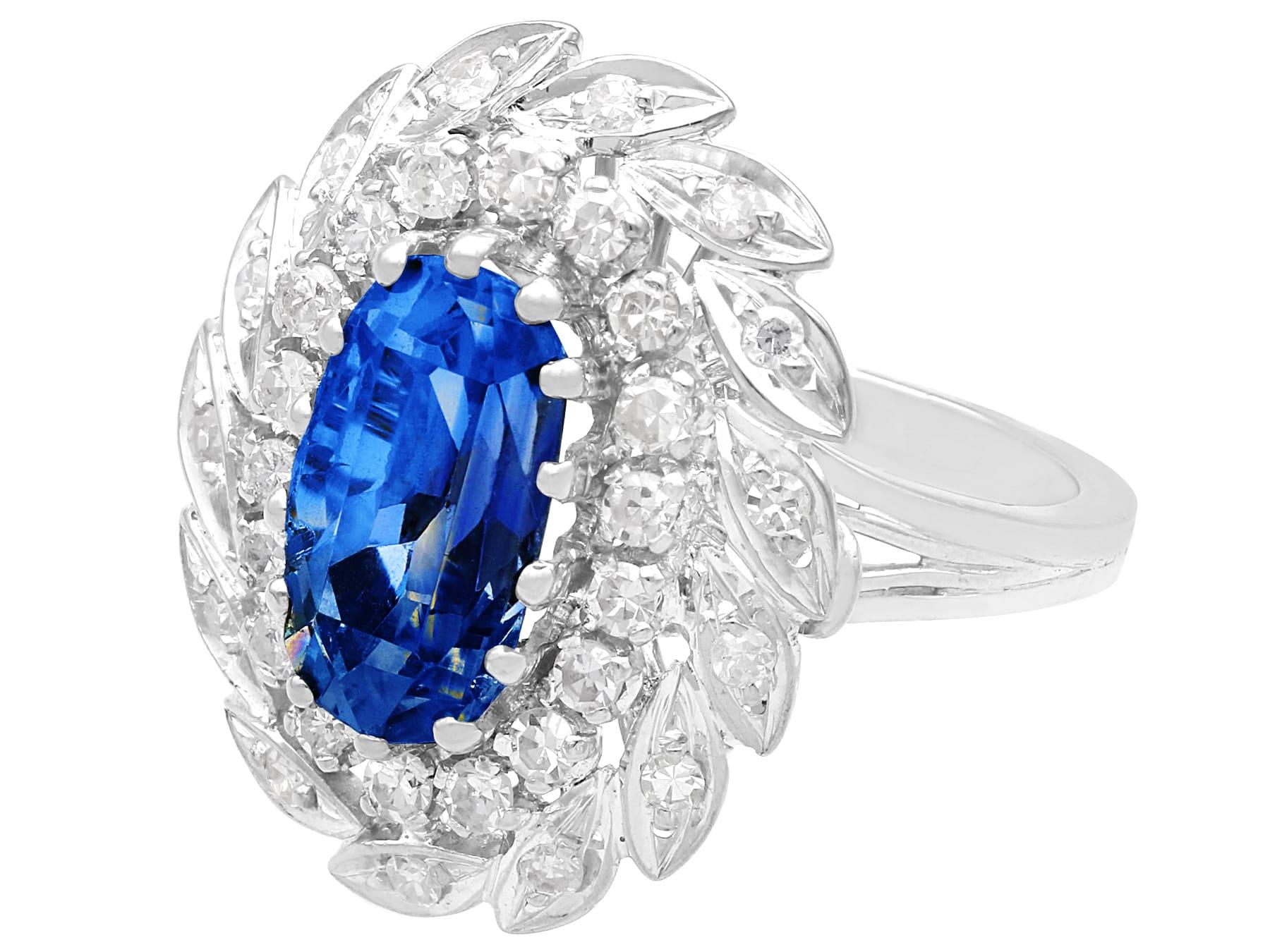Oval Cut Vintage 4.80 Carat Sapphire and 1 Carat Diamond White Gold Cluster Ring For Sale