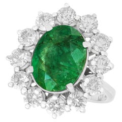 Retro 4.82 Carat Emerald 3.12 Carat Diamond White Gold Cluster Ring