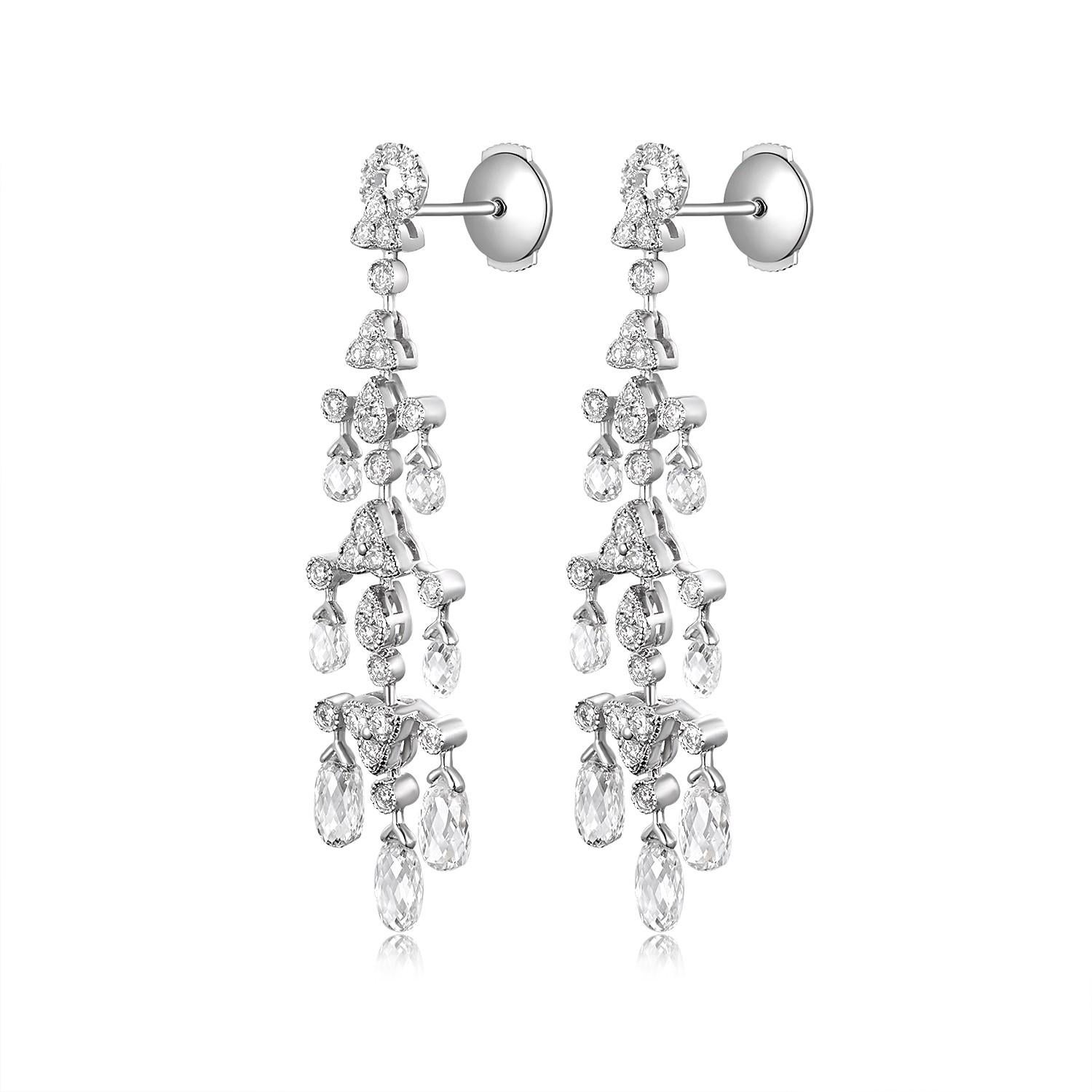These Vintage 4.83Ct Briolette Diamond Dangle Earrings are an embodiment of classic luxury combined with an exquisite touch of timeless elegance. Crafted meticulously in 18K white gold, they flaunt a lavish design that radiates with a sparkle that's