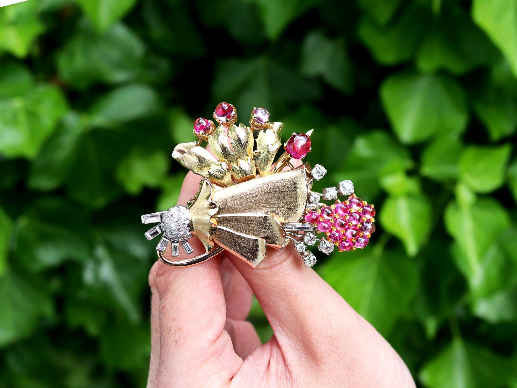 A stunning, fine and impressive 4.83 carat pink sapphire and 1.10 carat tourmaline, 1.36 carat diamond, 18 carat yellow and rose gold, platinum set brooch; part of our diverse vintage brooch collections.

This stunning, fine and impressive vintage