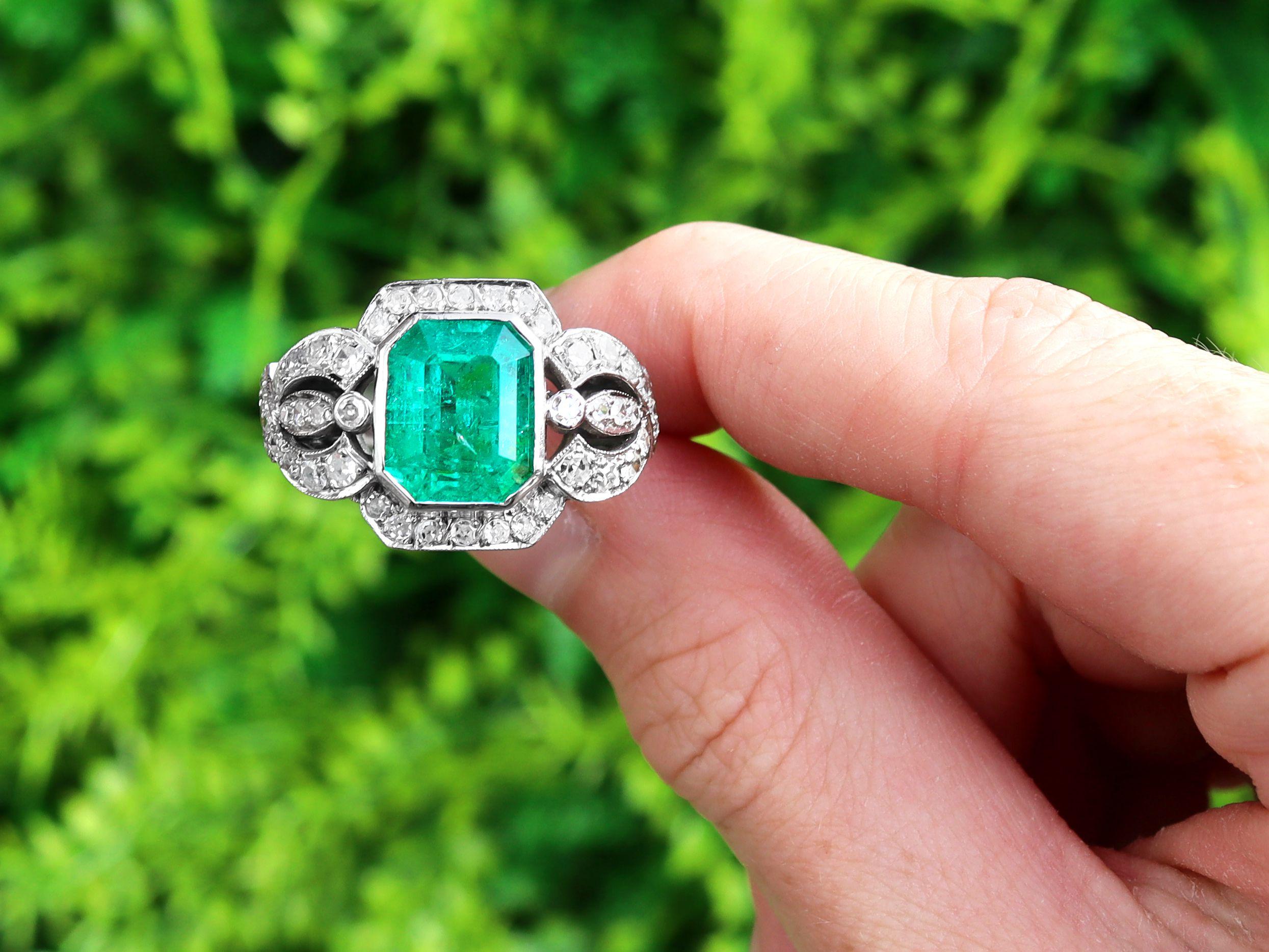 A stunning, fine and impressive vintage 4.85 carat emerald and 1.80 carat diamond, 9 carat gold and silver set dress ring; part of our jewellery and estate jewelry collections

This stunning, fine and impressive vintage emerald and diamond ring has