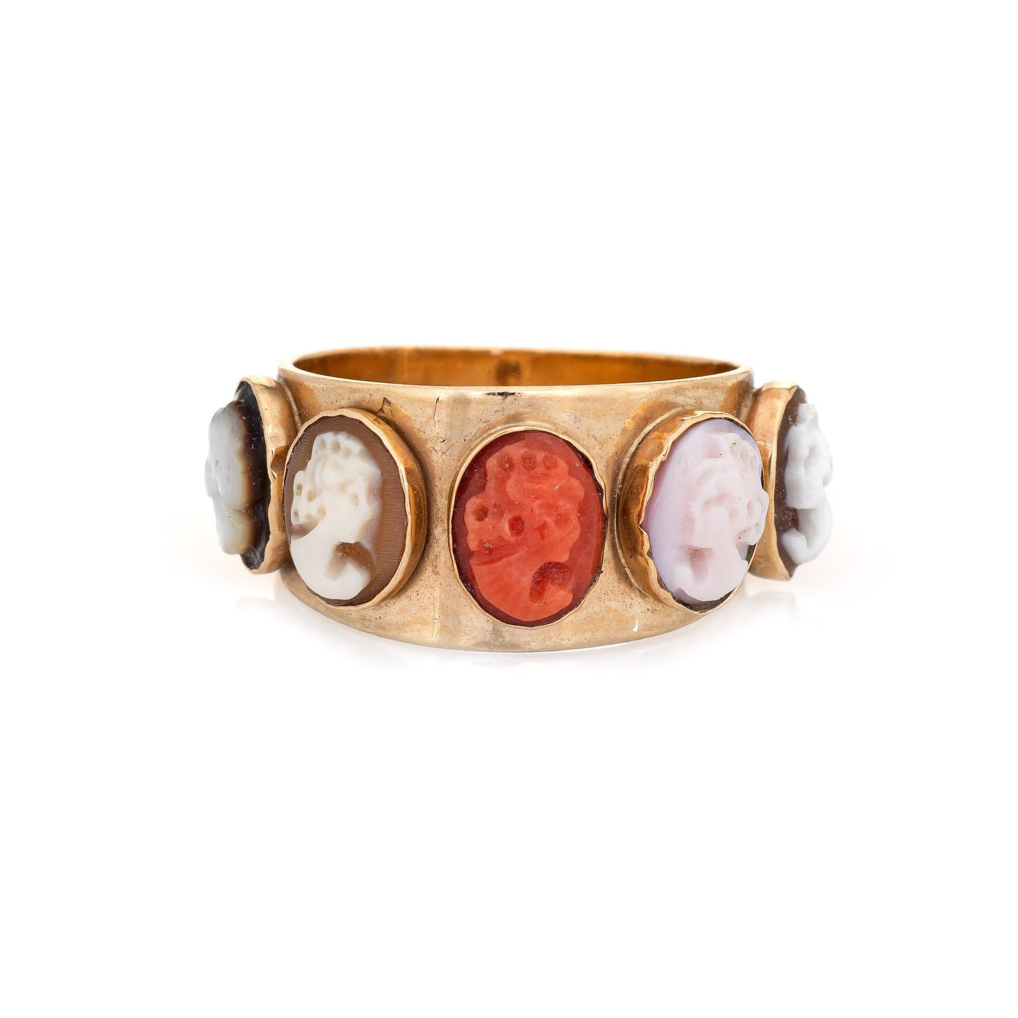 Stylish vintage five panel cameo ring (circa 1950s to 1960s) crafted in 14 karat yellow gold. 

Five cameos (agate, shell and coral) measure 6mm x 5mm. The cameos are in very good condition and free of cracks or chips. 

The five cameo ring