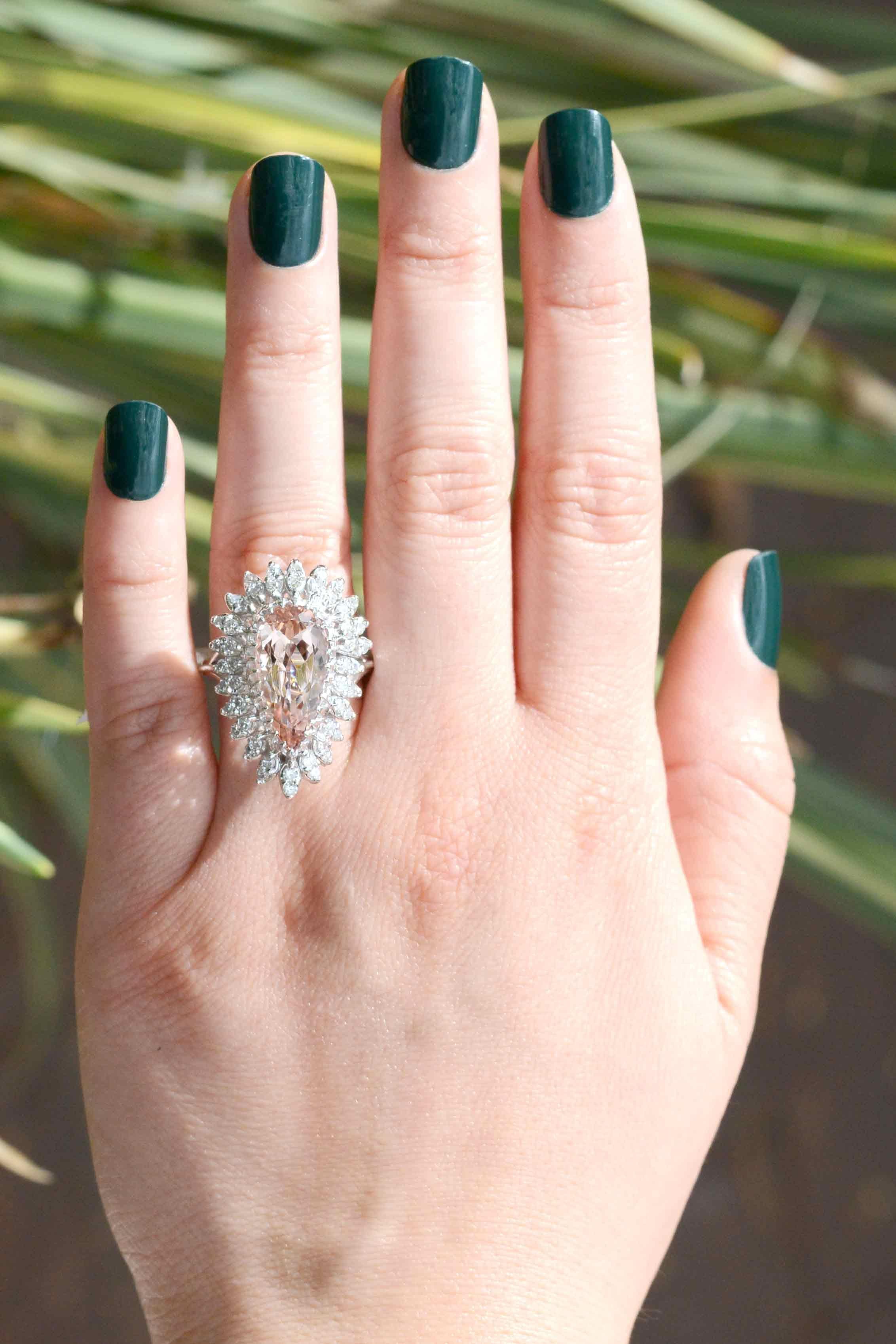 The Rosie 5 carat pear shape morganite ballerina cocktail ring. This is an awesome statement piece, vintage 1970s Hollywood glam at it's best. Centered by a captivating, sunset-peach natural gemstone of the beryl family (which includes aquamarine