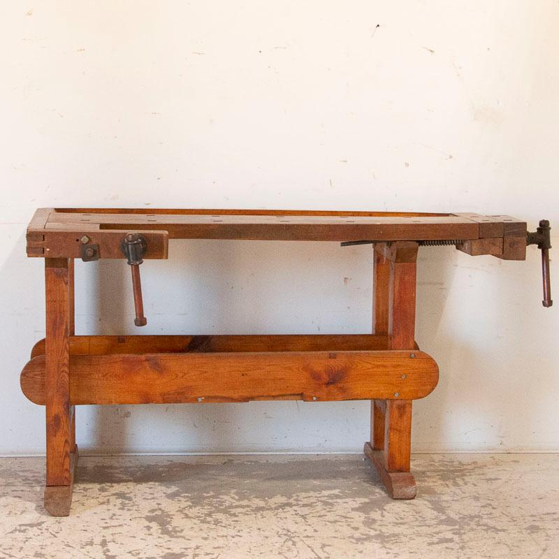 The deep patina of this authentic carpenter's workbench is a reflection of its age and years of use. Every ding, scratch, gouge and stain enrich the character and appeal of this old work table. Please examine the close up photos to appreciate the